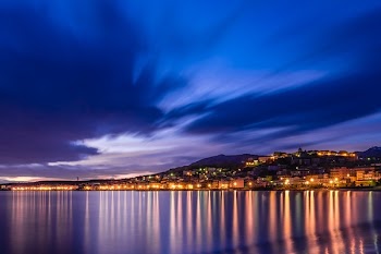 White Building Near Body of Water at Night