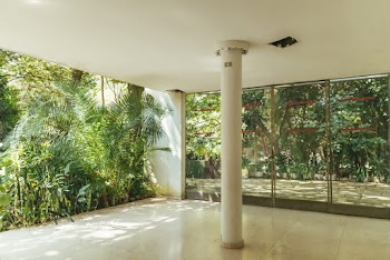 White Building Pillar Near Glass Windows