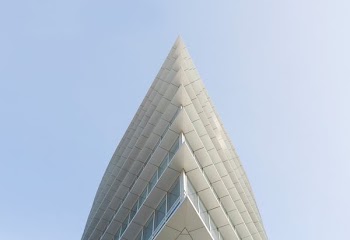 white building top under white skies