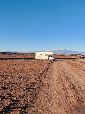 White Campervan on Dirt Road