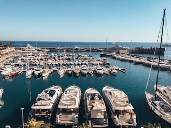 White Canoe Boat Parking on Sea Deck