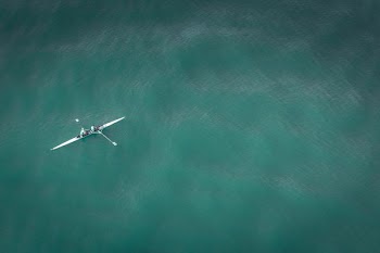 white canoe on body of water