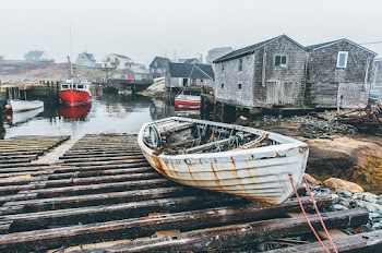 White Canoe on Brown Wooden Dock