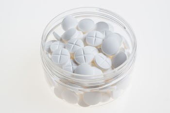 White Capsules in Jar