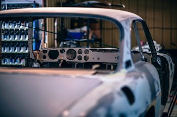 white car frame on garage