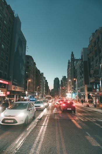 White Car on Asphalt Road during Dawn