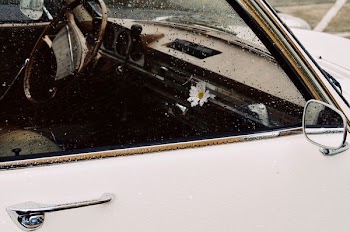 white car with rain drops