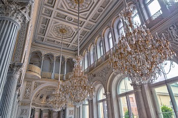 White Cathedral Hanging With Three Brown Uplight Chandelier
