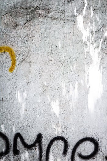 White cement wall with graffiti
