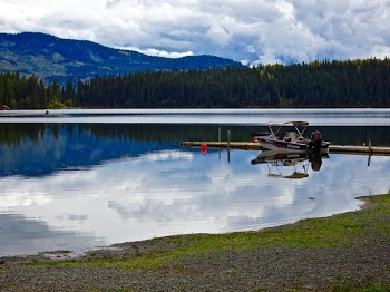 White Center Console Boat Parked at Dock