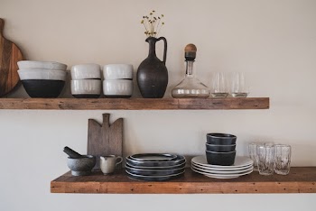 White Ceramic Bowls on Brown Wooden Shelf