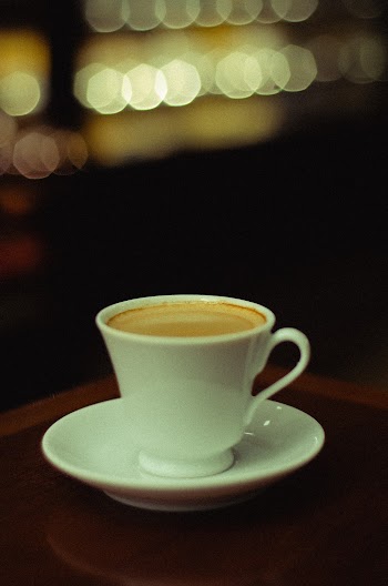 White Ceramic Coffee Cup on White Saucer