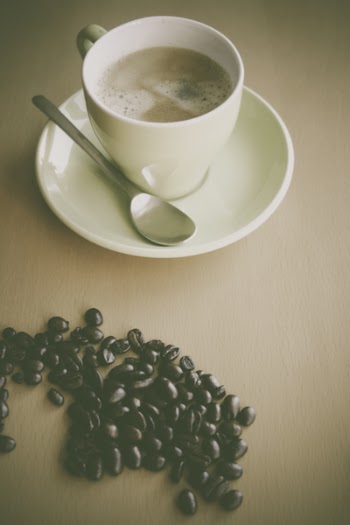 White Ceramic Coffee Mug Beside Silver Teaspoon on White Ceramic Plate