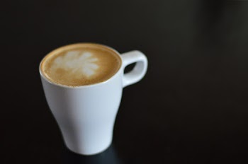 White Ceramic Coffee Mug on Black Surface