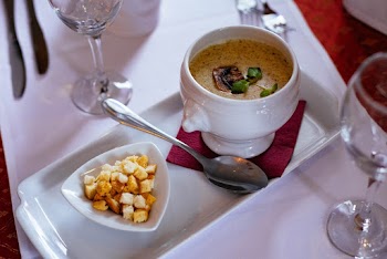 White Ceramic Container Beside Spoon