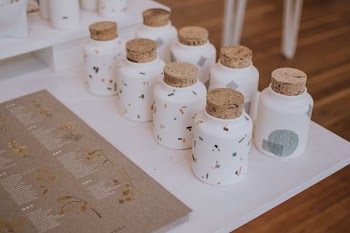 white ceramic containers on white tray