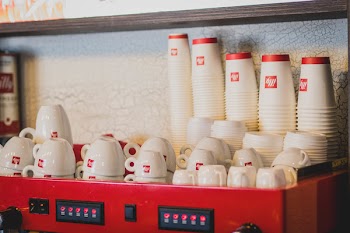 White Ceramic Cup Set Near Wall