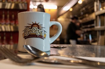 White Ceramic Mug Beside Spoon and Fork