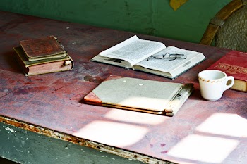 White Ceramic Mug Near Books