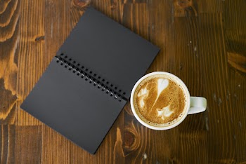 White Ceramic Mug on Brown Surface