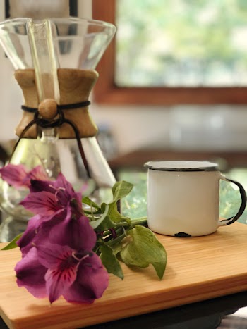 White Ceramic Mug on Brown Table