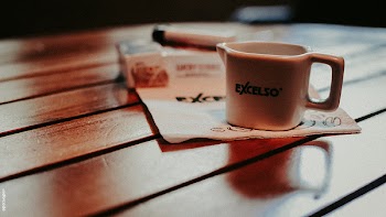White Ceramic Mug on Table