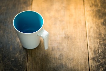 White Ceramic Mug on Table