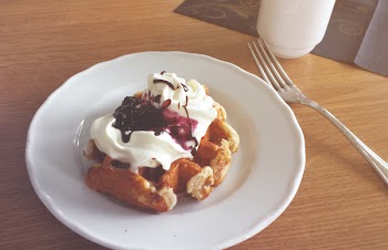 White Ceramic Plate Beside Stainless Steel Dining Fork
