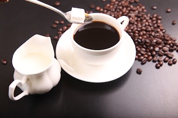 White Ceramic Sauce Boat Beside White Ceramic Cup