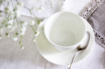 White Ceramic Tea Cup With Saucer and Spoon