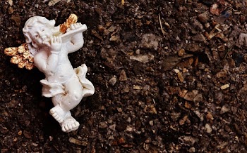 White Cherub Playing Flute Ceramic Figurine