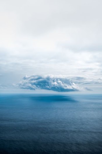 white clouds above sea