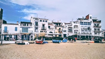 White Concrete Building Near Boat