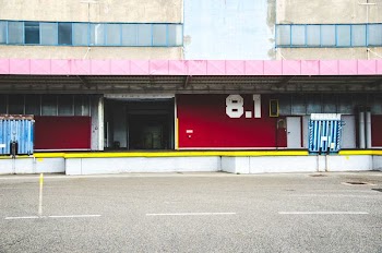 white concrete building near road