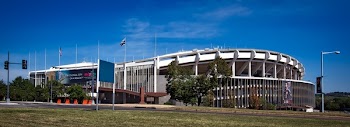 White Concrete Building on Green Grass Field during Daytime