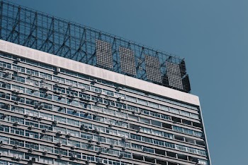 White Concrete Building Under Clear Blue Sky