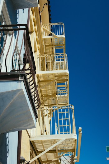 White Concrete Building With Balcony 
