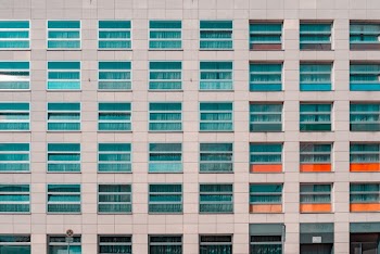 White Concrete Building With Glass Window