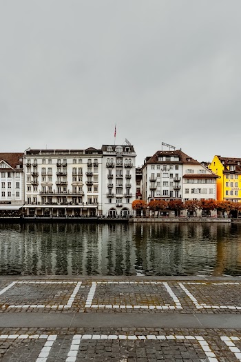 White Concrete Buildings Infront Of River
