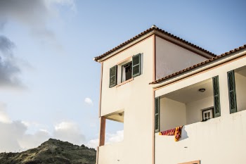 White Concrete House Under Blue Sky