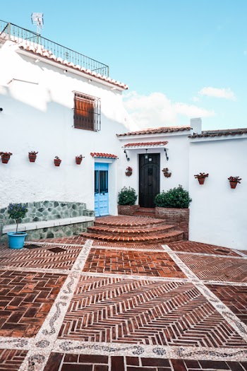 White Concrete House With Brown Tiled Yard