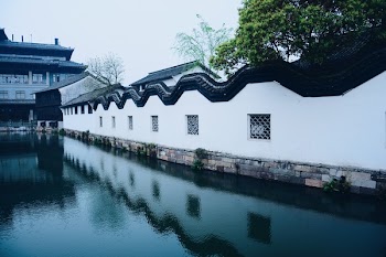 White Concrete Houses Near Body of Water