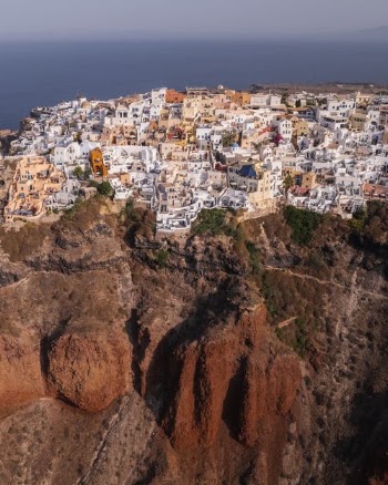 White Concrete Houses on Brown Rocky Mountain · Free Stock Photo