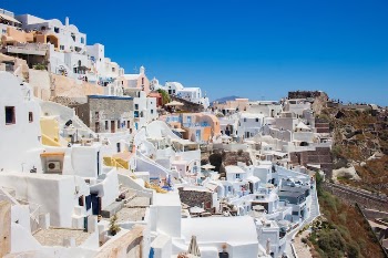 White Concrete Houses Under Blue Sky