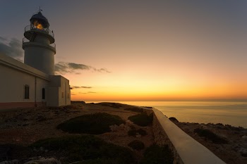 White Concrete Lighthouse during Golden Hour