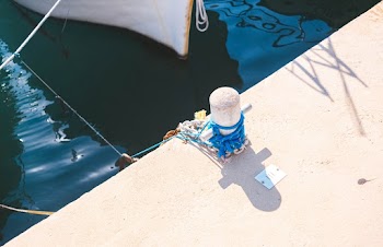 White Concrete Post Near Boat