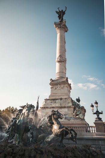 White Concrete Statue Under Blue Sky