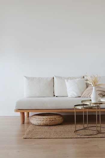 White Couch on Wooden Floor · Free Stock Photo