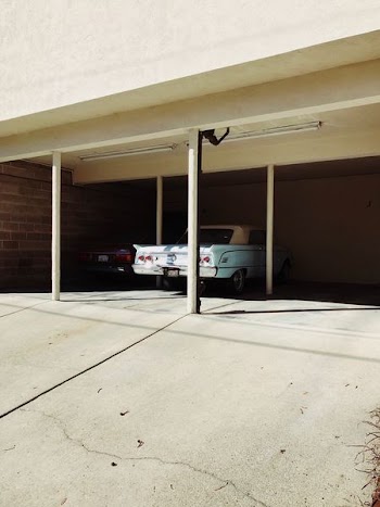 white coupe parked