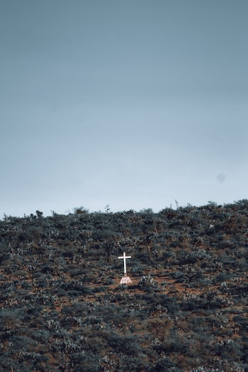 White Cross on Mountain Under Clear Blue Sky